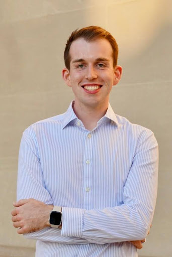 Bryce Huffman in a blue striped button up shirt