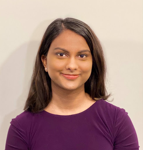 Alyssa Khan headshot in a purple shirt